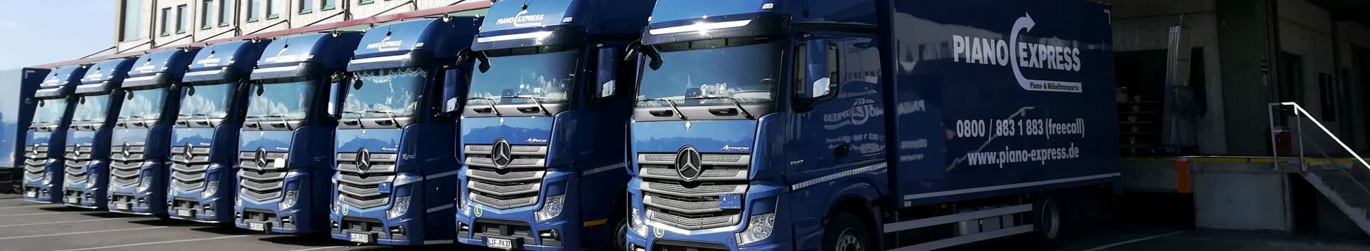 Flota de camiones de Piano-Express en el centro logístico – transportista especializado en pianos y muebles desde 2001